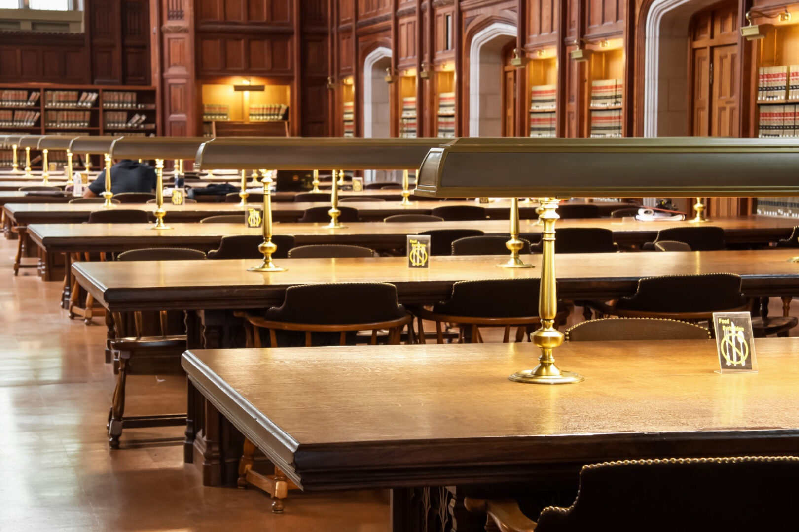 A large room with many tables and chairs.